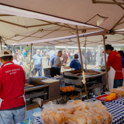 Outdoor catered event with The Hamburger Man serving guests